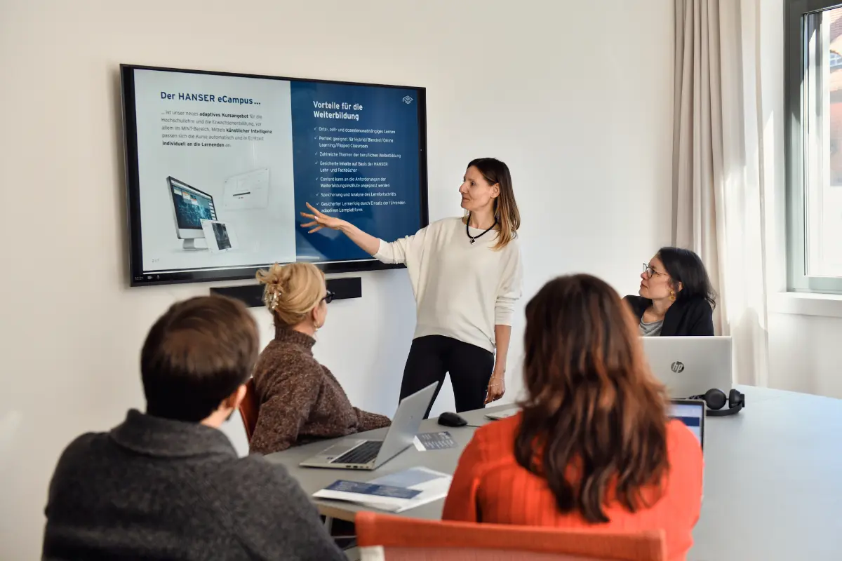 group of people looking at a presentation screen